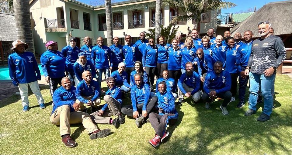 Germiston Callies members in blue club tracksuits at a club function